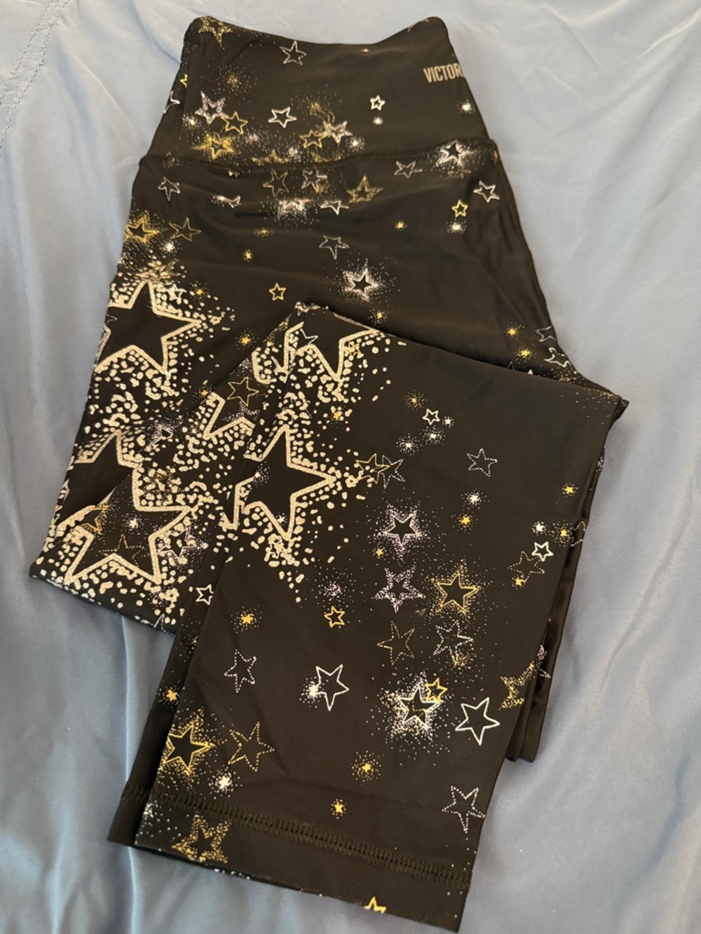 Victoria's Secret Black Leggings with Gold, White & Silver Star Print